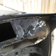The front dashboard area and A-pillar from the inside. “Lots of shaping and hammering here,” Nelson said. “The center hole is for accessing the cowl vents and wiper system. There are three plates that bolt over it.”